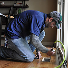technician cleaning an air duct